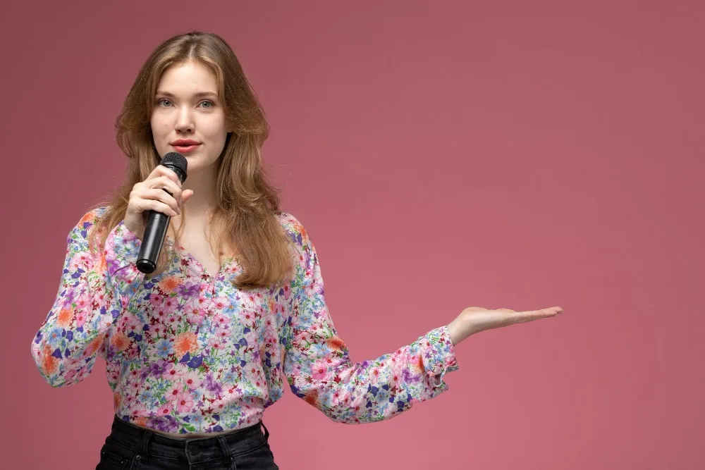 Woman speaking into a microphone